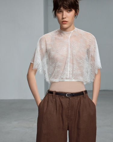 White lace blouse with short sleeves and high neck, cropped sheer overlay