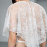 White sheer lace blouse back view with cape sleeves and keyhole detail