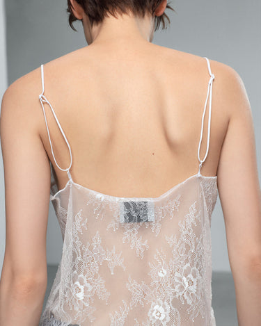 White lace camisole top with open back and thin adjustable straps