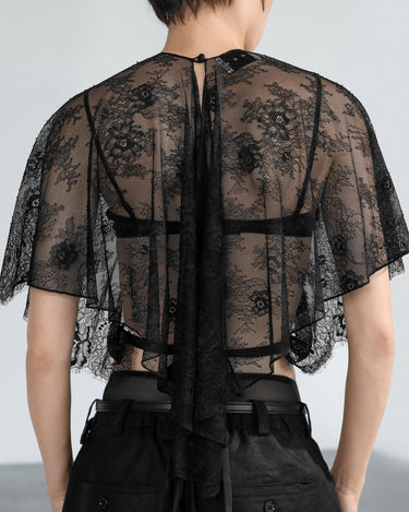 Black sheer lace blouse back with vertical band and keyhole cutout at neck
