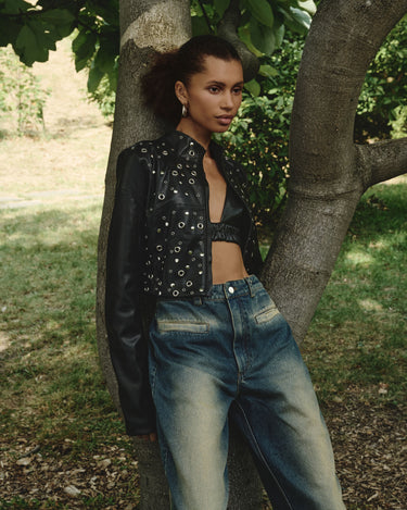 Black eco-leather eyelet jacket with silver studs on front, long sleeves