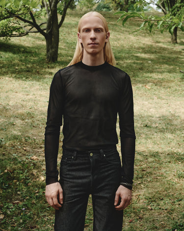 Dark sheer mesh turtleneck top with high neck and long sleeves