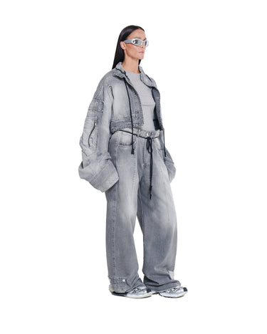 Distressed cropped gray denim jacket with point collar and oversized puff sleeves, side view