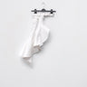 White denim skirt with asymmetric layered hem and waistband buttons