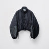Men's black puffer jacket with oversized sleeves, stand collar, snap front and drawcord hem