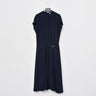 Navy fluid midi dress on hanger with tie detail at waist and side slit