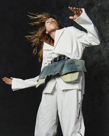 White denim-illusion apron with blue frayed waist panel, black belt and layered apron ties