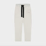 Cream cropped sweatpants with black drawstring and Theo logo on right thigh