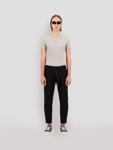 Black cropped sweatpants with drawstring waist; worn by model in front view.