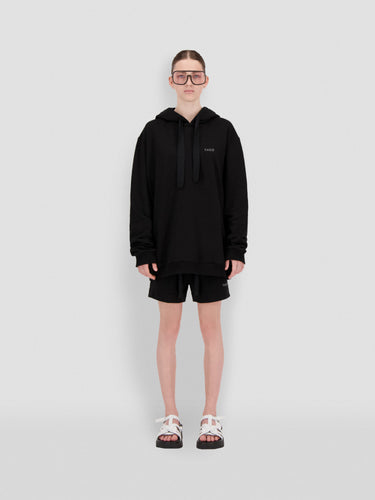 Black hoodie with Theo logo on chest, pullover hood and drawstring