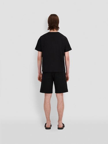 Black jersey T-shirt, back view, crew neck short sleeves